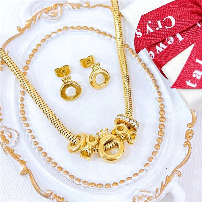 Guangzhou Fat Fruit Trading Co., Ltd. Stylish stainless steel set Crown hoop earrings Snake chain necklace charm set lady gift