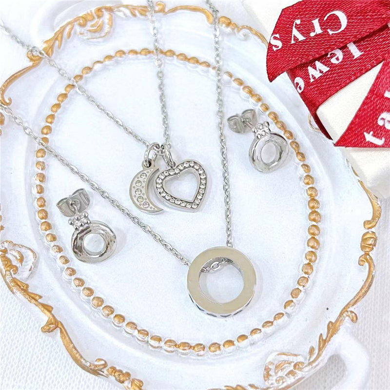 Guangzhou Fat Fruit Trading Co., Ltd. Stylish stainless Steel Set Shining Moon Love Ring Double earrings necklace Charm Set gift for women