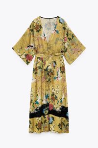 Featuring an elastic waistband a matching belt and covered buttons a full sleeved V neck dress with floor length