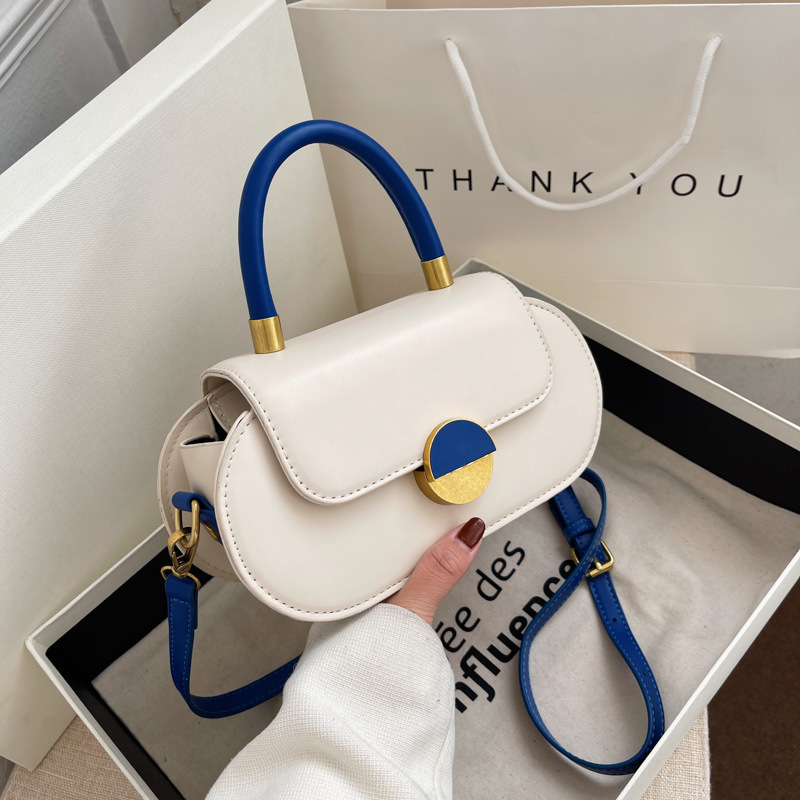 Yiwu Kang Barium Trading Co., Ltd. 2024 New Street trend contrasting saddle Handbag Fashion oval phone bag PU single shoulder ID bag