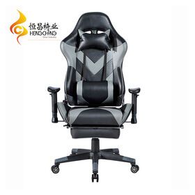 Ergonomic gaming chair with adjustable headrest and pillow