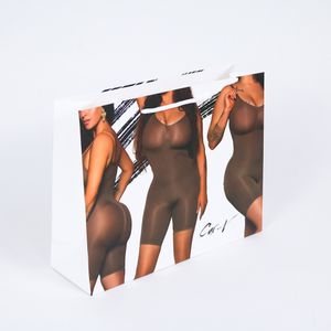 Luxury Boutique Shopping Gift UV clothes Custom Printed Logo underwear die-cut handles Packaging orange Kraft Paper Bags