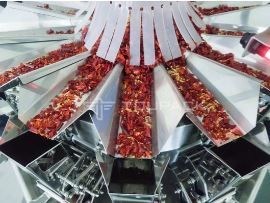 Packing machine with multihead weigher