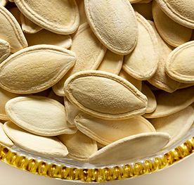 snow white pumpkin seeds in shell/kernels