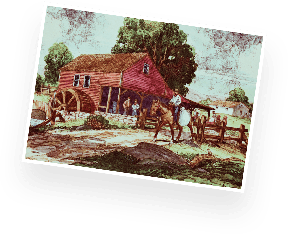 man on a horse by an old water-powered flour mill