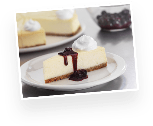 cheesecake drizzled with blueberry sauce
