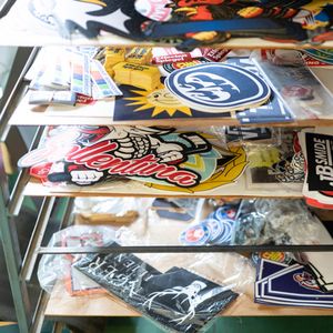 Printed merchandise (banners, flags, scarves, minidresses, stickers)