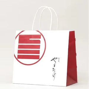 Hot Selling Portable Eco-friendly Shopping Kraft Paper Packaging Bag Thickened Kraft Paper Ribbon Paper Handle Handbag