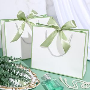 Wholesale Luxury Paper Bags Recyclable Hand-held Gift Bags Customized Logos with Ribbons