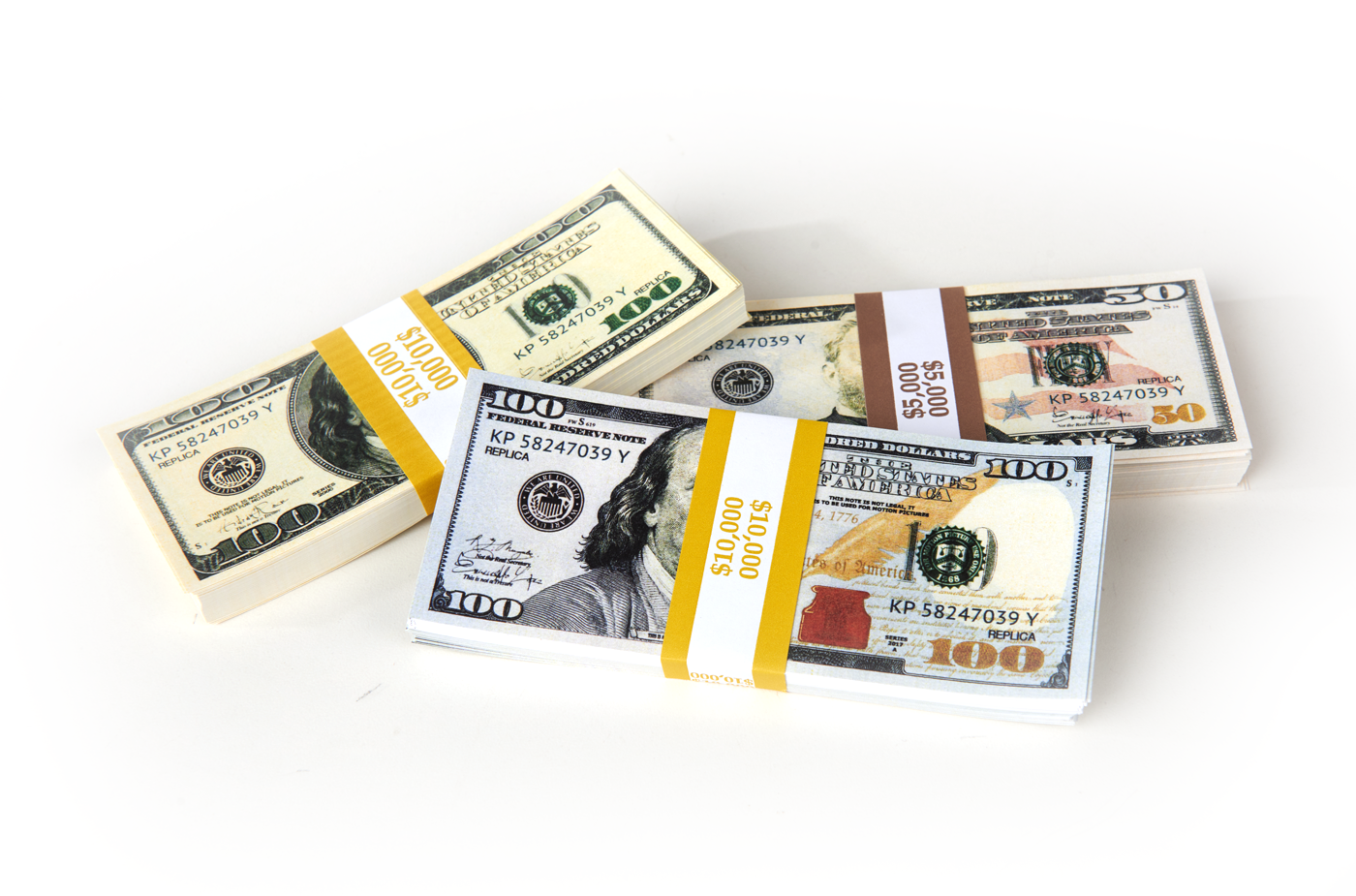$25,000 - 1 Stack of 2013 Series 100s, 1 Stack of 1980s Series 100s, 1 Stack of 50s Prop Money