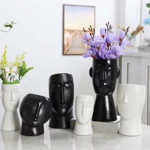 Ceramic Face Vase designed in Art Decor style and made with Under Glazed White or Black suitable for placement on a tabletop
