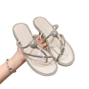 Rhinestone sandals female summer new fairy wind a word cross clip toe flat bottom outside wear beach sandals