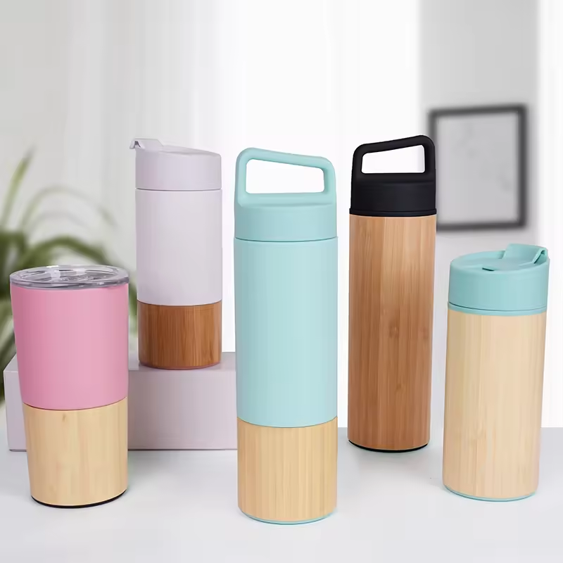 Lu'an Xinmao International Trade Co., Ltd. Promotional BPA free design bamboo thermos steel mugs travel coffee cups custom tumbler bamboo water bottle