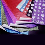 Wrapping Papers with Holographic Designs