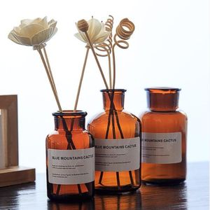 New Arrival Amber Color 100ml 200ml 250ml Aromatherapy Round Glass Bottles With Cork For Reed Diffuser