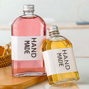 Factory Customizable 200ml 250ml 350ml 500ml  Home Shape Transparent Refill Glass Bottle For Beverages Liquor With Metal Lid