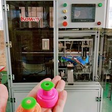 Auto-pack machine for plastic cosmetic bottles, pull push plastic cap assembly robot