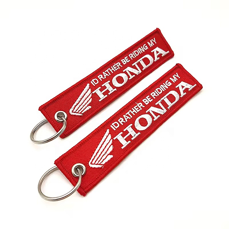 Shenzhen Awells Craft Co., Ltd. Hot Tag Woven Motorcycle Flight Label Fabric Woven Embroidered Keychain