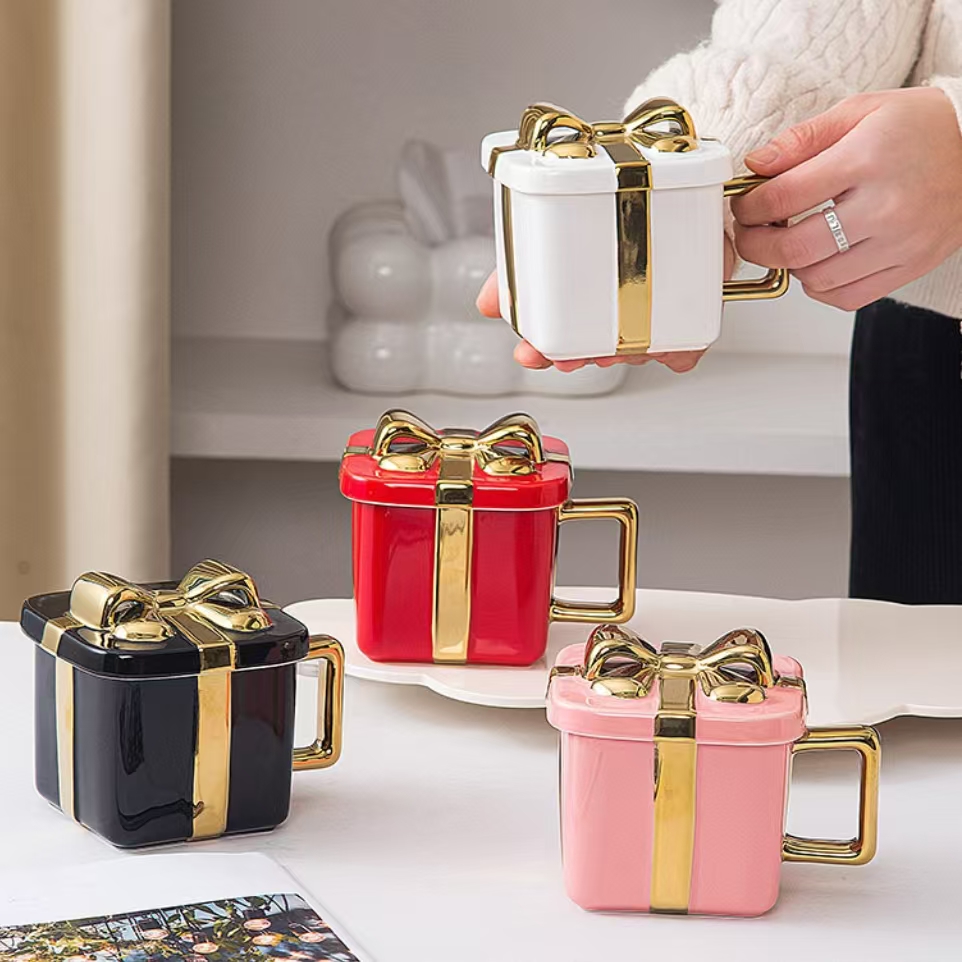 Dehua Chensheng Ceramic Craft Factory Custom logo high quality bow gift box design ceramic coffee tea milk mug Christmas cup for gift